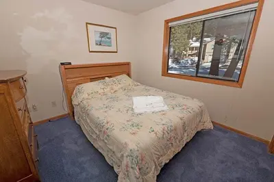 a small bedroom with a bed and a window at 2293 Marshall Trail home in South Lake Tahoe