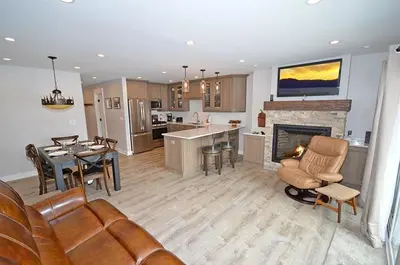 a kitchen and living room with a couch and a fireplace at 405 Ala Wai Blvd, 180 condo in South Lake Tahoe