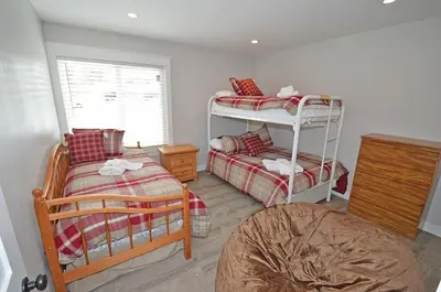 a bedroom with two bunk beds and a window at 405 Ala Wai Blvd, 180 condo in South Lake Tahoe