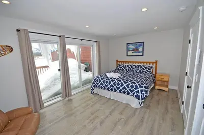 a bedroom with a bed and a sliding glass door at 405 Ala Wai Blvd, 180 condo in South Lake Tahoe