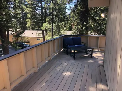 a porch with a bench on a deck at Fun & Air Conditioned Lake Tahoe 3 BR/2.5 BA Home in Incline Village
