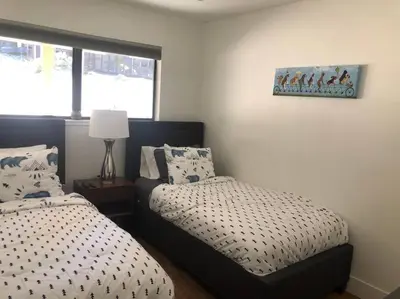 a bedroom with two beds and a window at Fun & Air Conditioned Lake Tahoe 3 BR/2.5 BA Home in Incline Village