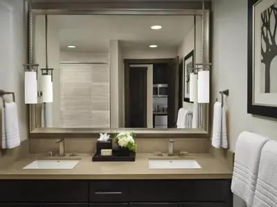 a bathroom with two sinks and a large mirror at Hyatt Vacation Club at Northstar Lodge in Truckee