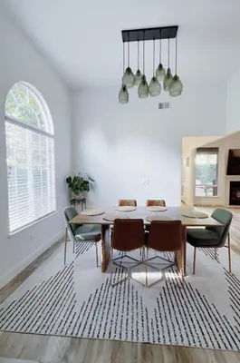 a dining room with a table and chairs at Serene Modern Family Getaway Near Midtown Downtown and Folsom Lake in Elk Grove