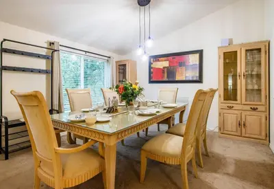 a dining room with a table and chairs at Yosemite's Scenic Hideaway in Midpines