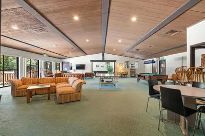 a living room with couches and a ping pong table at Private/Cozy Kings Beach Retreat in Tahoe Vista