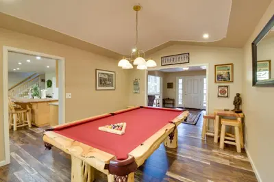 a pool table in the middle of a room at Gas Grill and Pool Table Cabin Near Calaveras Park! in Arnold