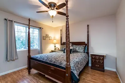 a bedroom with a bed and a ceiling fan at Inside Yosemite Winter Wonderland in Yosemite West