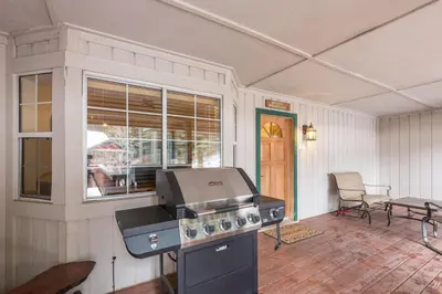 a kitchen with a grill and a table and chairs at Inside Yosemite Winter Wonderland in Yosemite West