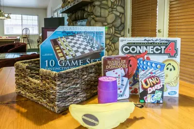 a basket of games and other items on a table at Inside Yosemite Winter Wonderland in Yosemite West