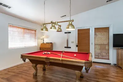 a room with a red pool table in it at Upper Cascades in Yosemite West