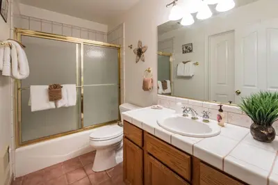 a bathroom with a sink and a shower and a toilet at Upper Cascades in Yosemite West