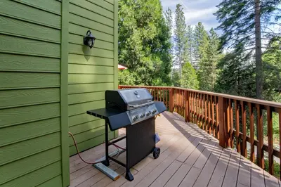 a grill on a deck on a house at Anderson's Alpine Retreat- Pinecrest, CA Dodge Ski in Cold Springs