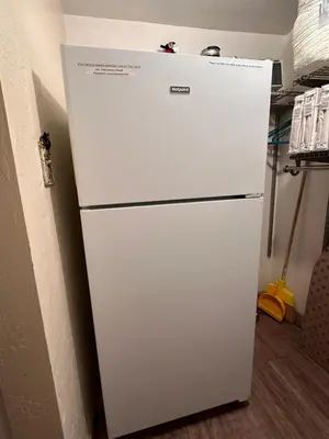 a white refrigerator in a kitchen next to a wall at Yosemite Condominium Loft unit -B202 in Yosemite West