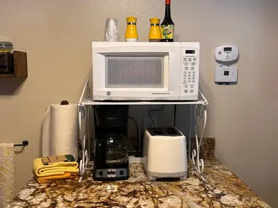 a microwave sitting on top of a kitchen counter at Yosemite Condominium Loft unit -B202 in Yosemite West