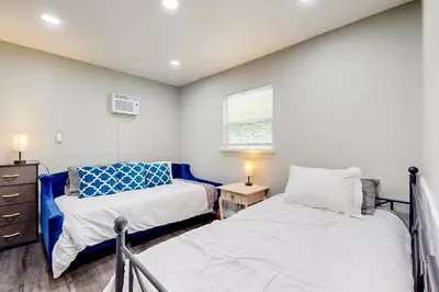 a bedroom with two beds and a window at Riverside Retreat in Bethel Island Fish and Boat! in Bethel Island
