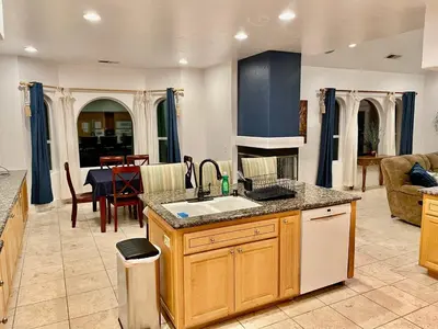 a kitchen with a sink and a counter top at Peacock House Sleeps 12 Hot Tub Game Room in Ahwahnee