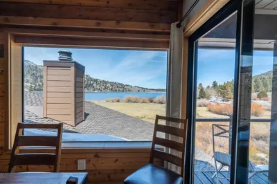 a view of a lake from a room with a window at Rr-edgewater10 in June Lake