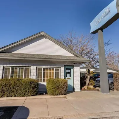 a house with a sign in front of it at Charming Retro Property #3! in Sparks