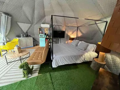 a model of a bedroom with a canopy bed at Enchanted Forest Dome ,10-15 minutes to Kings Canyons-New pellet stove for cozy warm nights in Dunlap