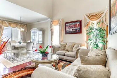 a living room with two couches and a table at Outdoor Oasis and Hot Tub! Spacious Clovis Home in Clovis