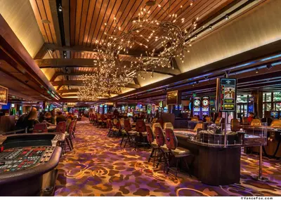 a casino with a bunch of tables and chairs at Golden Nugget Lake Tahoe in Stateline