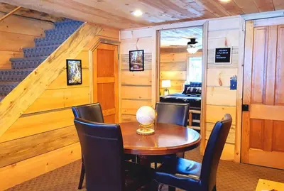 a dining room with a wooden table and chairs at Sequoia Splendor, inside Kings Canyon NP by Visitors Center in Wilsonia