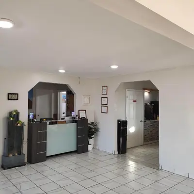 a large room with a counter and a kitchen at Star Inn in Tonopah