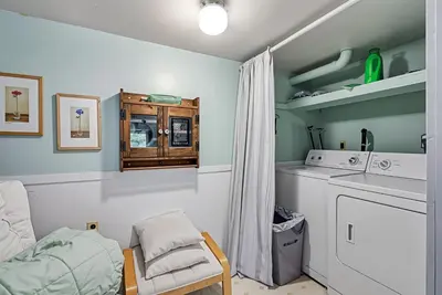 a laundry room with a washer and dryer at Tranquil Retreat - Home with Spacious Deck & Grill home in Groveland