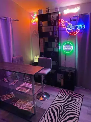 a room with a table and a neon sign at Scenic view villa near Yosemite in Groveland