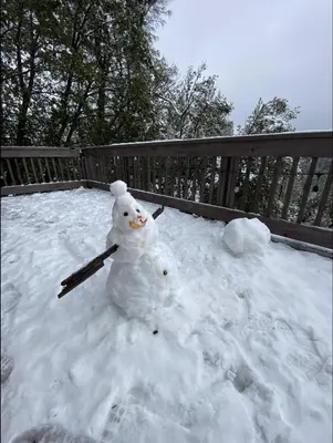 a snowman sitting on top of a pile of snow at Scenic view villa near Yosemite in Groveland