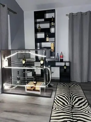 a living room with a zebra rug and a display case at Scenic view villa near Yosemite in Groveland
