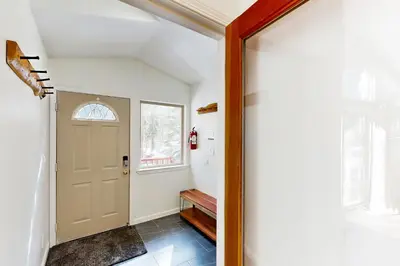 a hallway with a door and a window at Forest Grove in Kings Beach