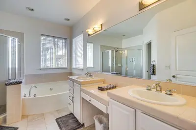 a bathroom with a sink and a bath tub and a sink at Theater Room, Fireplace Home 5 Mi to Dtwn Reno! in Sparks