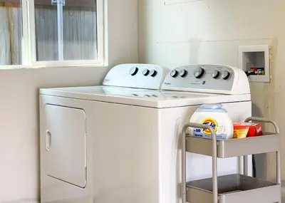 a washer and dryer in a room with a window at Folsom Old Town Escape in Folsom