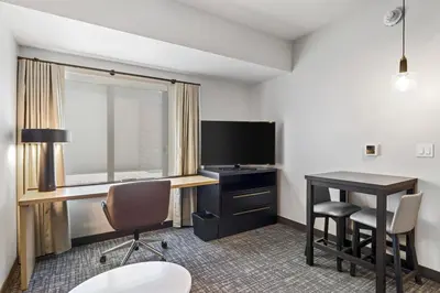 a hotel room with a desk and a television at Residence Inn by Marriott Lodi Stockton in Lodi