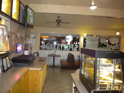 a bar with a fish tank in a room at Wasco Inn in Wasco