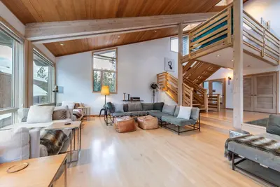 a living room with a loft with a staircase at Bright 5BD Alpine Retreat - 5Min to Alpine Meadows in Tahoe City