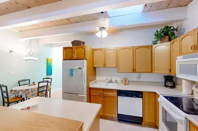 a kitchen with wooden cabinets and a counter top at Take a Peak in Incline Village