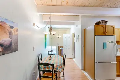 a kitchen and dining room with a table and a refrigerator at Take a Peak in Incline Village