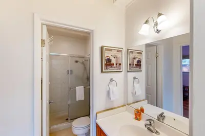 a white bathroom with a sink and a shower at Take a Peak in Incline Village