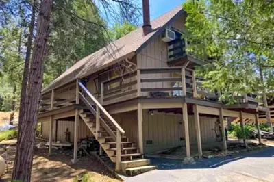 a large house with a staircase leading up to it at Cardinal's Nest in Groveland