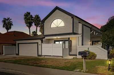 a grey house with a garage and a parking meter at * Large Updated Waterfront Delta Manor Boat Dock * in Discovery Bay