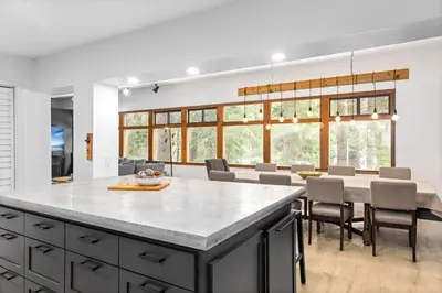 a kitchen and dining room with a table and chairs at Sunnyside Retreat - Tahoe City, 4 BR, Pet Friendly, Bonus Room in Tahoe City
