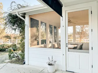 a screened in porch with a sliding glass door at Pickleball Retreat near Bass Lake & S. Yosemite in Ahwahnee