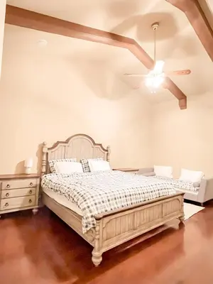 a bedroom with a bed and a ceiling fan at Pickleball Retreat near Bass Lake & S. Yosemite in Ahwahnee