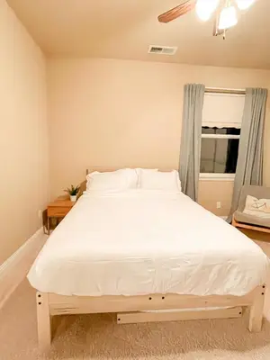 a bedroom with a large white bed with a window at Pickleball Retreat near Bass Lake & S. Yosemite in Ahwahnee