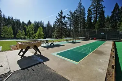 a ping pong court with a picnic table on a tennis court at WHouse*HotTub*Sleeps20*BLS*FirePit*AC&Heat*DogsOk in Arnold