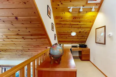 a room with a staircase with a wooden ceiling at Hot Tub Hideaway in Dorrington