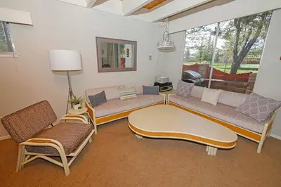 a living room with couches and a coffee table at Ala Wai BoulevardApartment 23 in Lake Valley